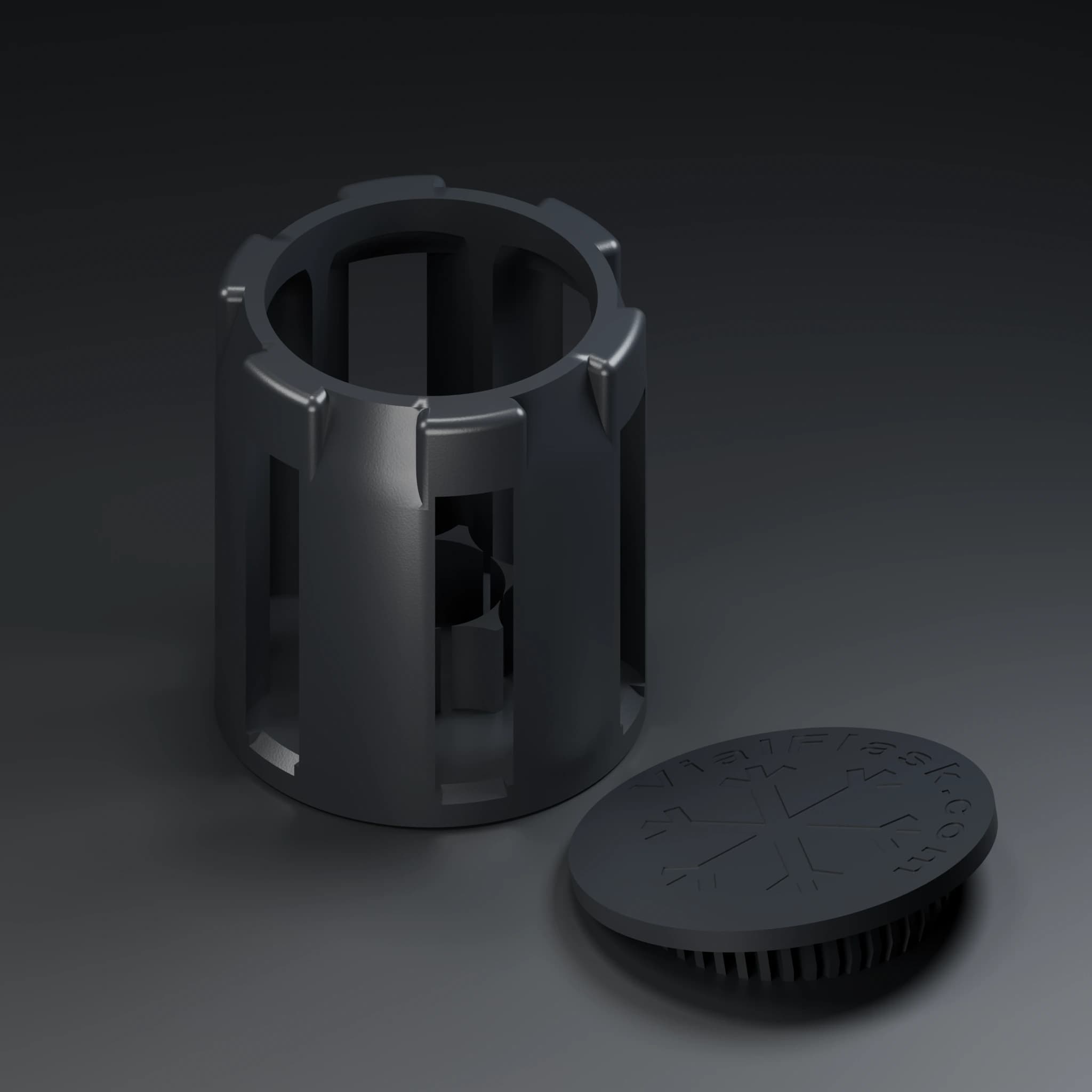 Black insert cage with its engraved snap-in lid set beside it