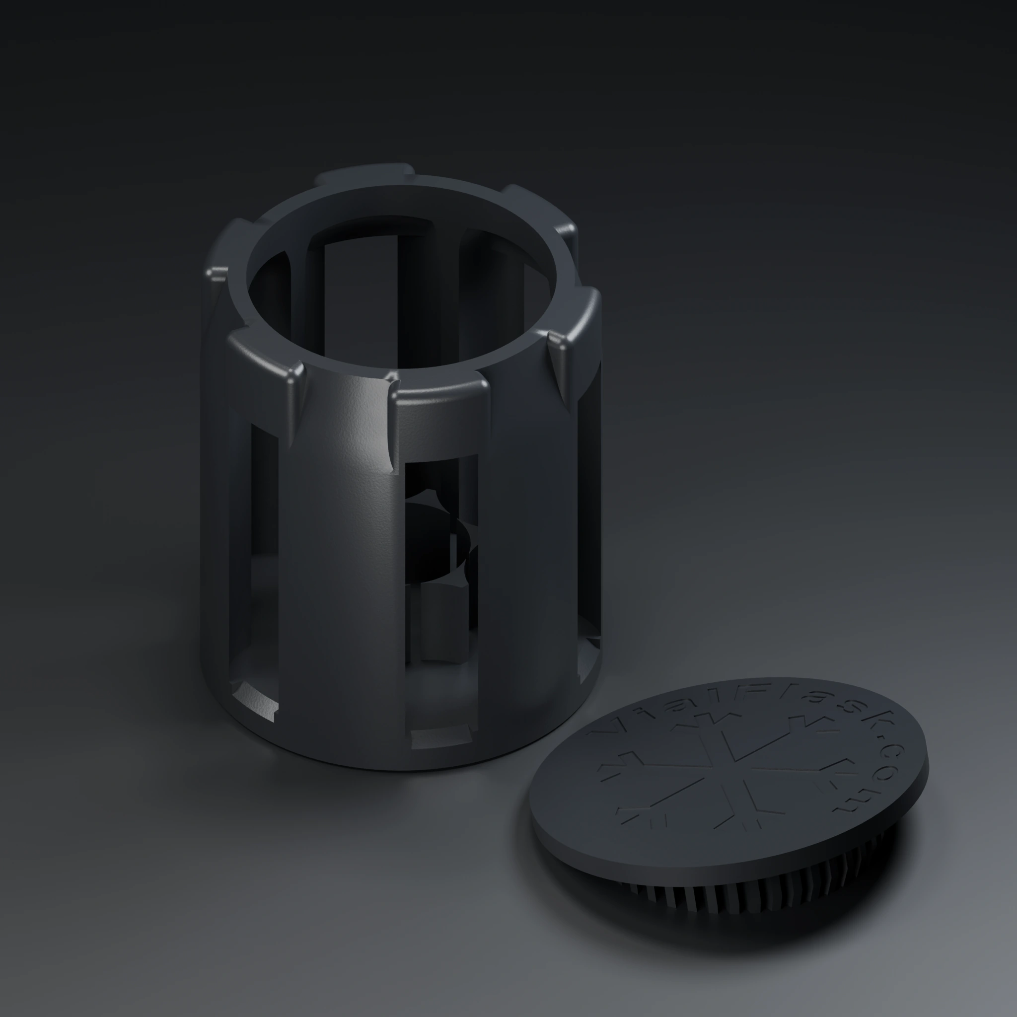 Black insert cage with its engraved snap-in lid set beside it